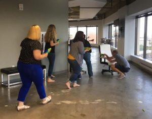 The Alight team celebrated the first day in the new HQ with a dart gun war.